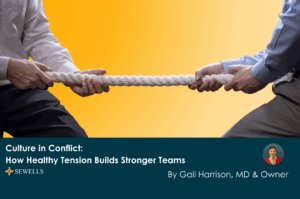 Too business people havinga tug of war symbolising tension and conflict but in a positive team building way